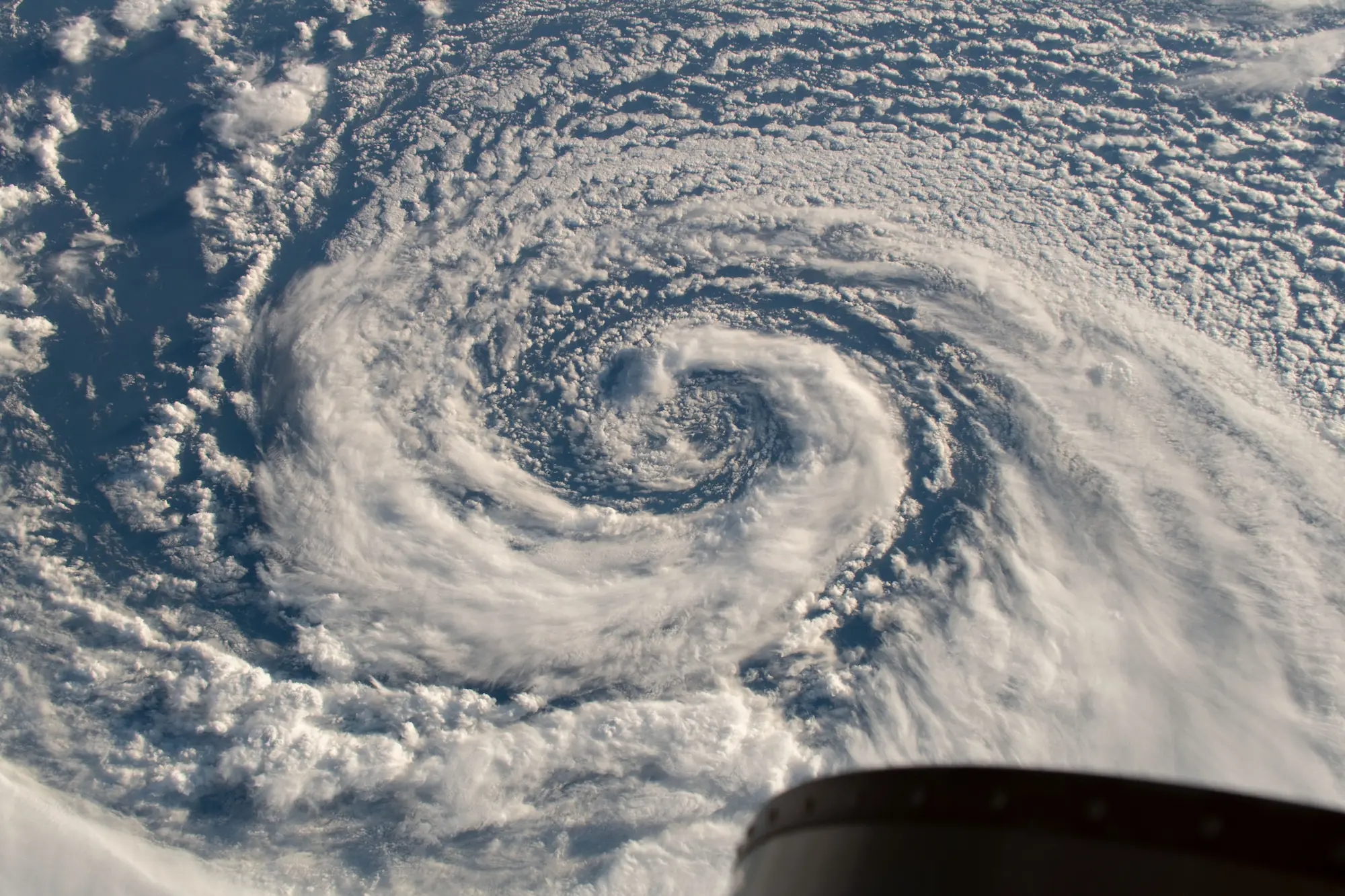 Spiraling cloud bands of a hurricane over the Pacific Ocean near Alaska — photograph from ISS Expedition 57, 17 December 2018, NASA Johnson Space Center